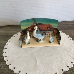 Vtg Goose Figurine Set on Background